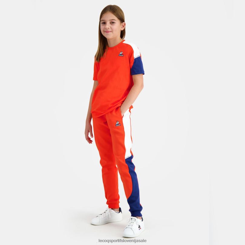 otroci oblačila Le Coq Sportif hlače oranžne 60J4R642